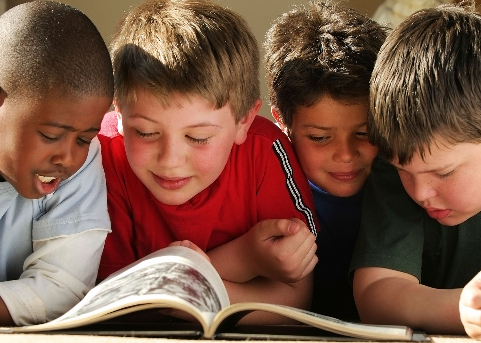 four boys reading