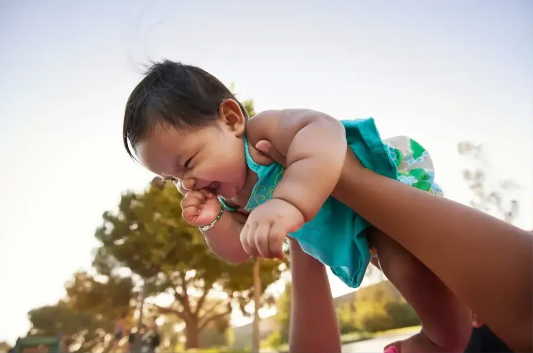 baby being lifted up